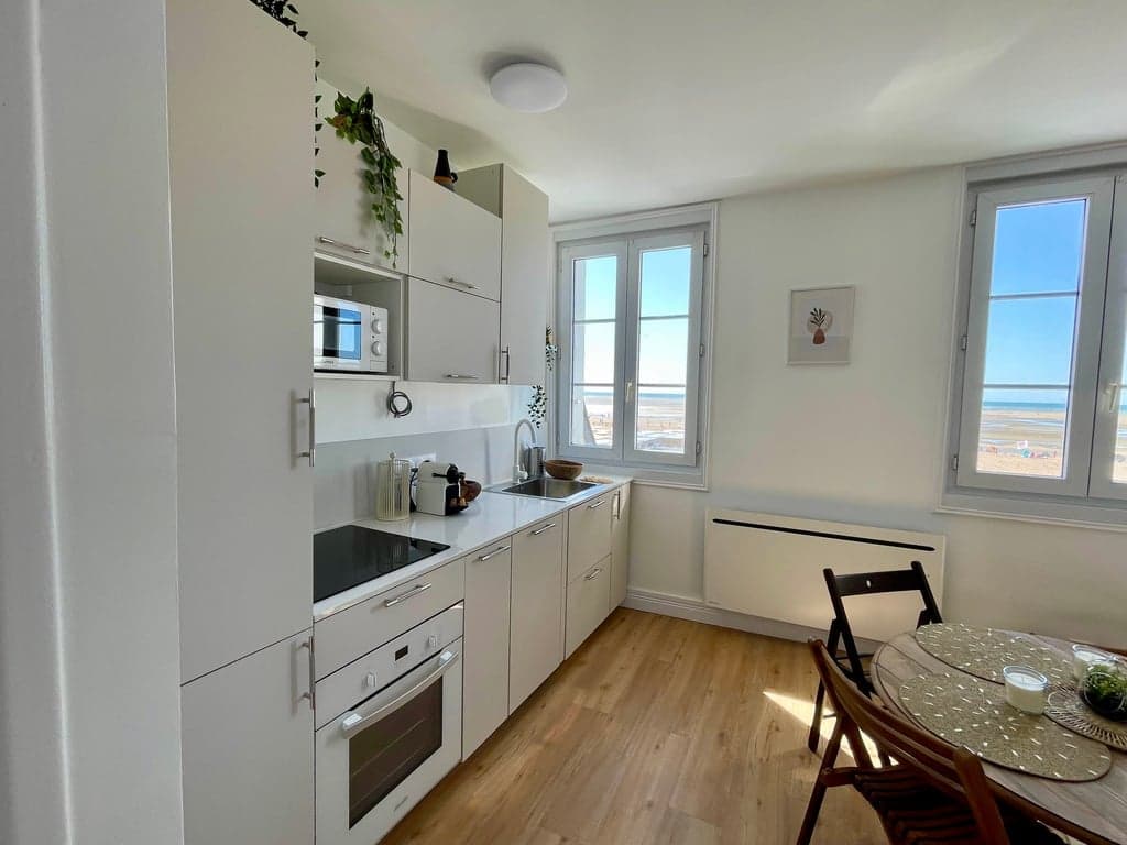 Bright living room opening onto the Houlgate beach in Normandy